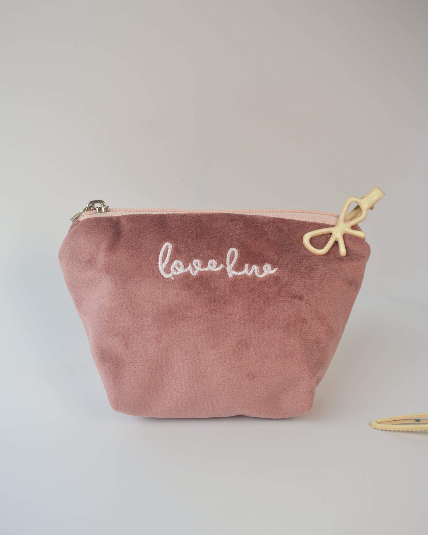 SWANS COIN PURSE IN MAUVE
